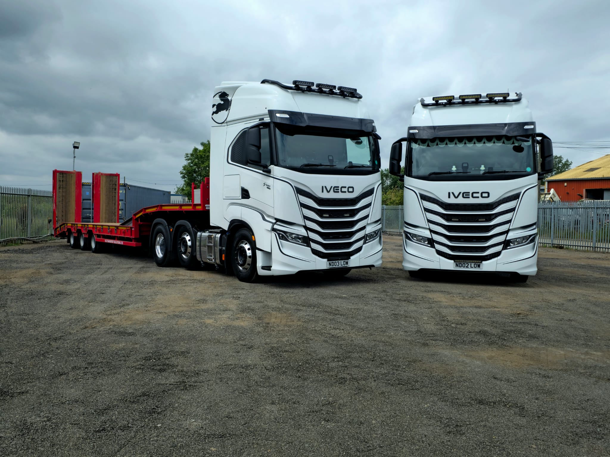 Two N.D. Transport Solutions tractor units with low loader trailers