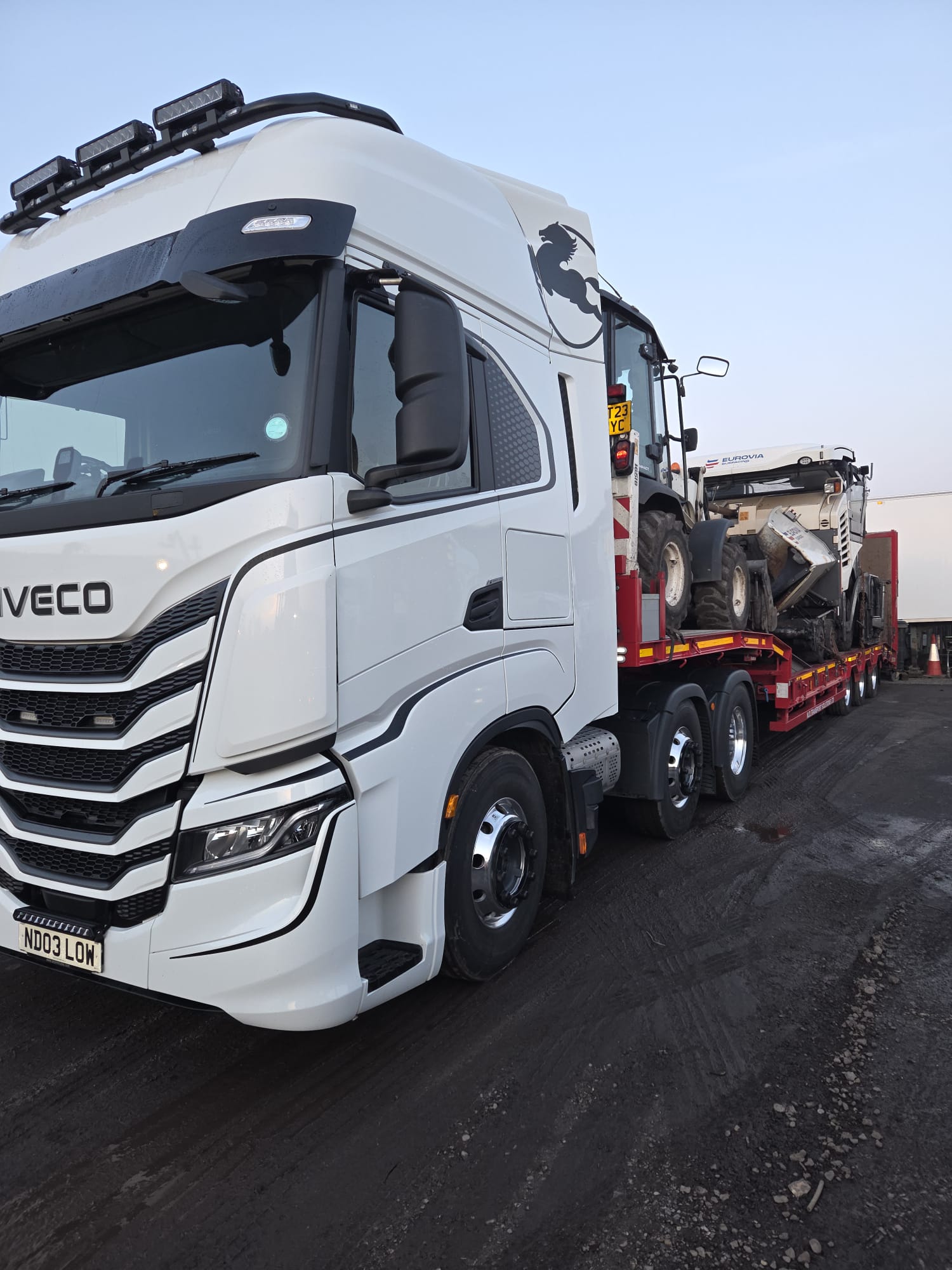Plant machinery loaded for transport between sites